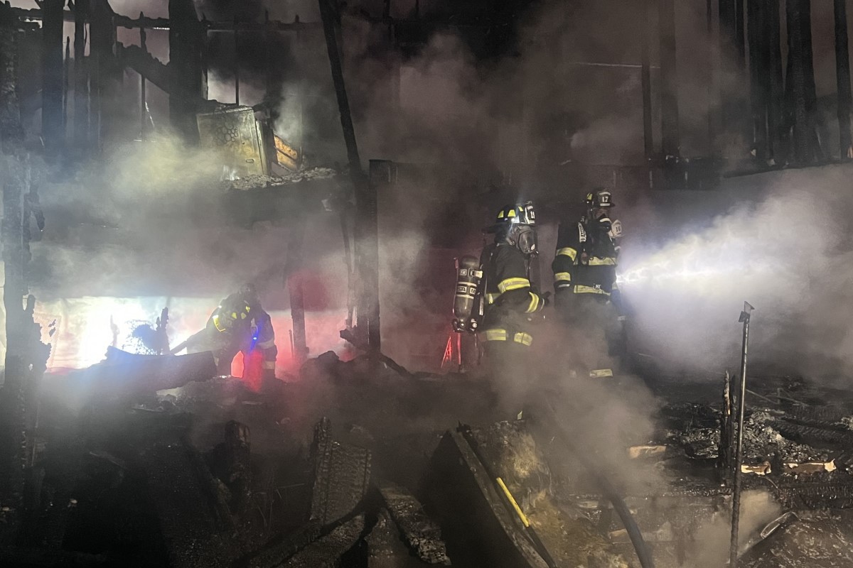 House burns down in Woodlawn, damaging nearby homes as well