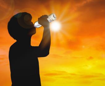 Man Drinking Water in Sun