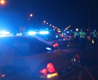 CLarksville Police Vehicles with Blue Lights On At Night