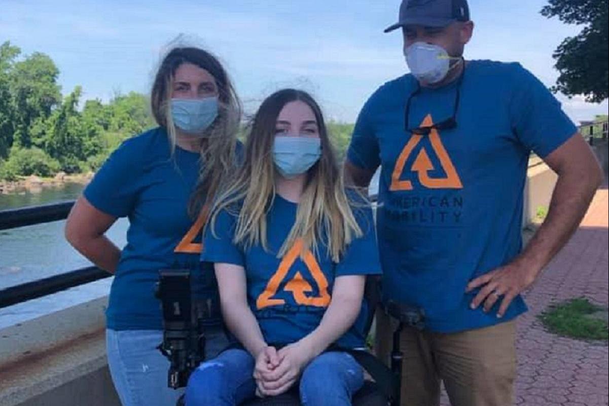 Emily, paralyzed since age 5, can now go to the beach with specialized wheelchair