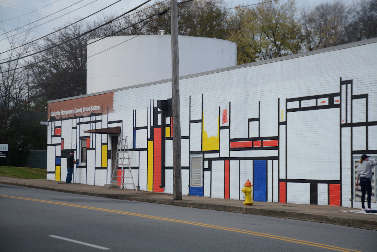 Students paint mural on School Board building in style of famous artist Students paint mural on School Board building in style of famous artist