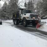 A snow plow clears a residential street in downtown Clarksville on Feb. 18, 2021. (Chris Smith)