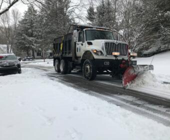 A snow plow clears a residential street in downtown Clarksville on Feb. 18, 2021. (Chris Smith)
