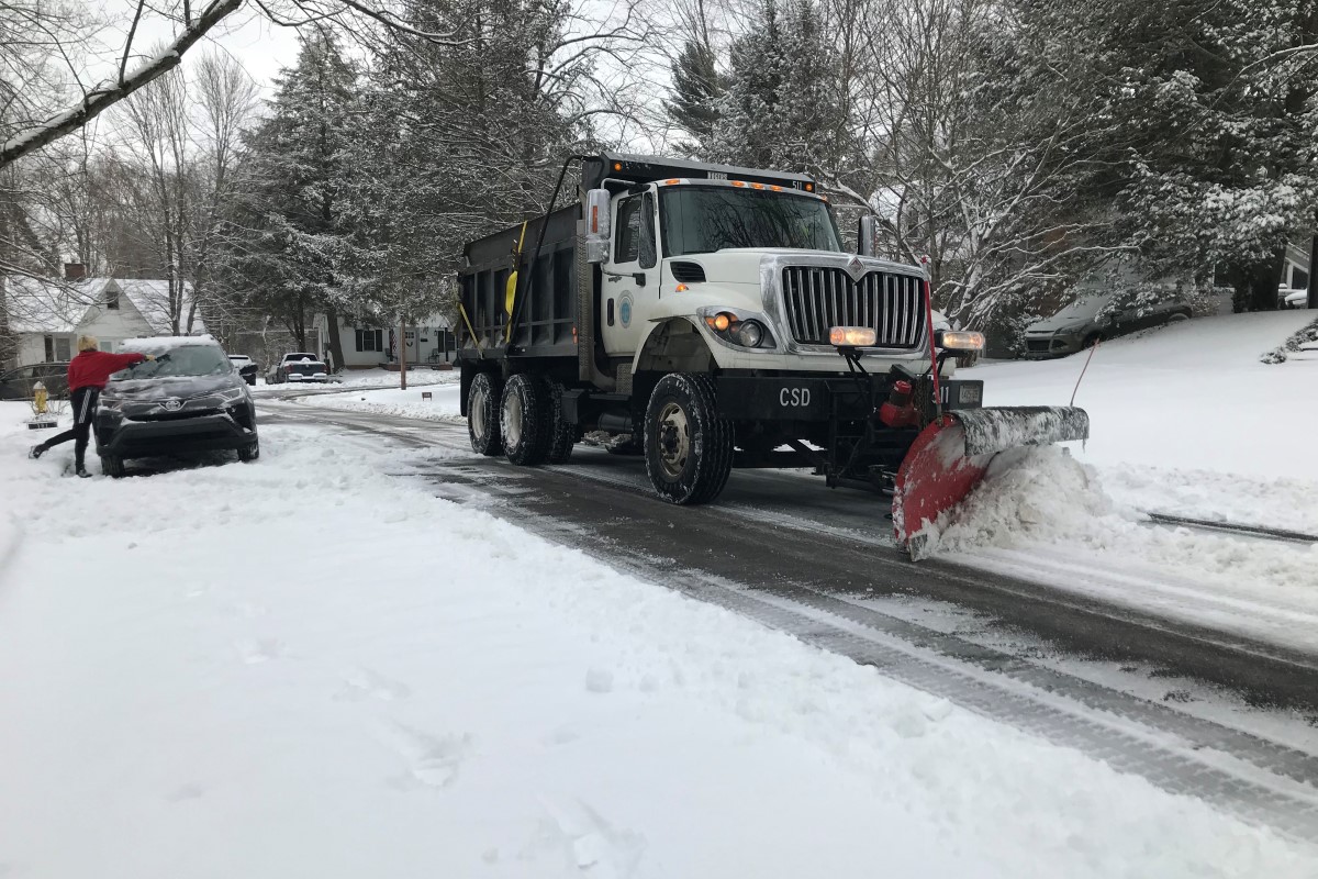 A snow plow clears a residential street in downtown Clarksville on Feb. 18, 2021. (Chris Smith)