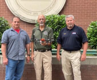 Chuck Phillips, Rodney Grimsley and Jimmie Edwards with the EMA's newest drone package. (Contributed)