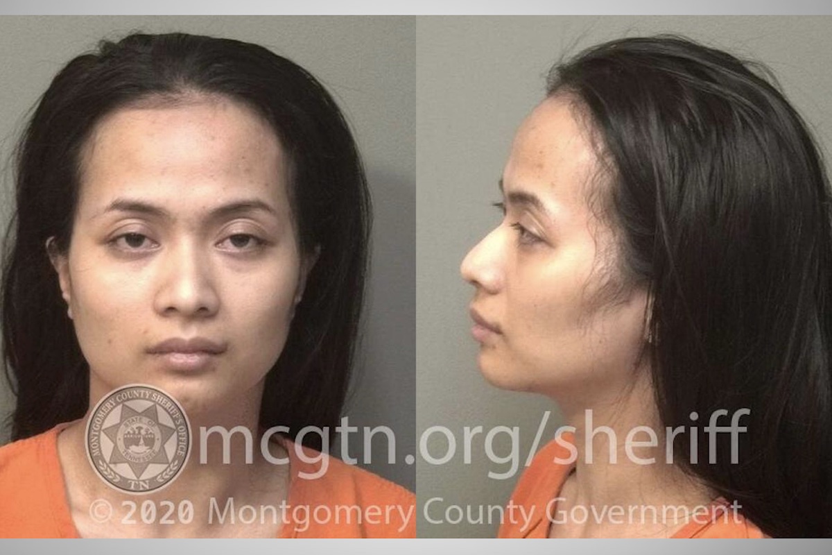 Woman charged with killing husband after security video showed her carrying gun Woman charged with killing husband after security video showed her carrying gun