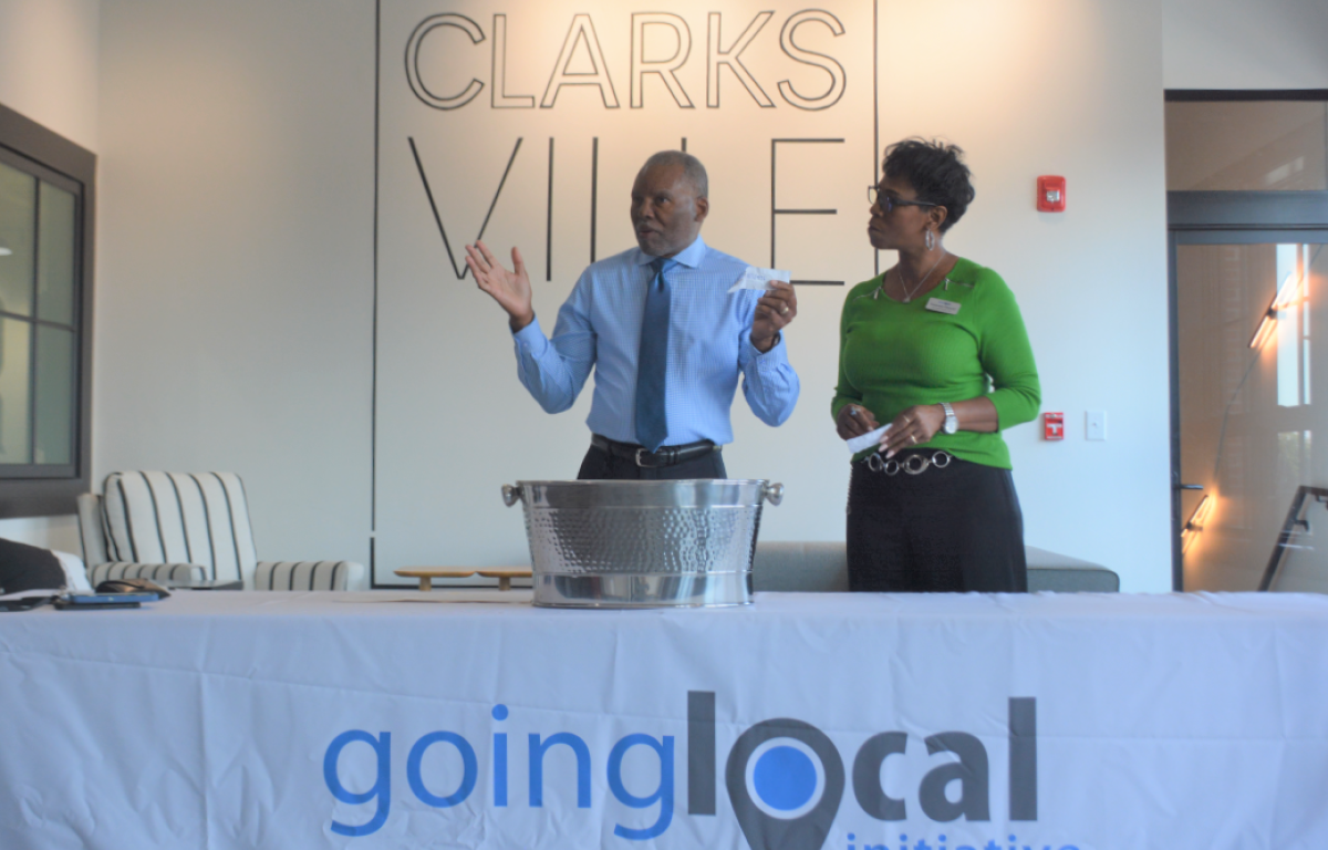 CNCS Executive Director Dennis Newburn and Going Local Initiative Executive Director Yolanda Stewart announce the home giveaway winners on Sept. 19, 2022. (Christian Brown)