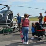 Visitors enjoy looking over one of the helicopters at Just Plane Fun Days at the Clarksville Regional Airport on, Sep. 24, 2022. (Lee Erwin).