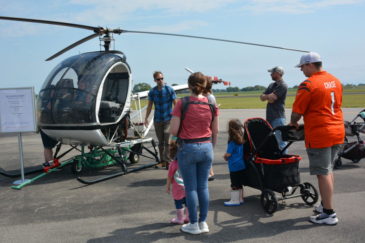 Visitors enjoy looking over one of the helicopters at Just Plane Fun Days at the Clarksville Regional Airport on, Sep. 24, 2022. (Lee Erwin).