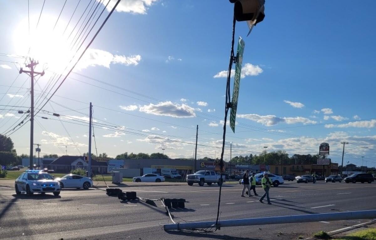 A vehicle crashed into a utility pole on Fort Campbell Boulevard at Cunningham Lane, knocking the power lines down, on May 2, 2023. (CPD photo)