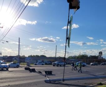 A vehicle crashed into a utility pole on Fort Campbell Boulevard at Cunningham Lane, knocking the power lines down, on May 2, 2023. (CPD photo)