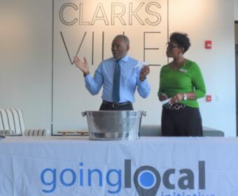 CNCS Executive Director Dennis Newburn and Going Local Initiative Executive Director Yolanda Stewart announce the home giveaway winners on Sept. 19, 2022. (Christian Brown)