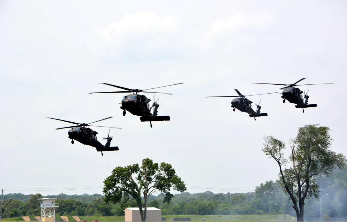 Helicopters fly over the Air Assault School on Fort Campbell as part of the Air Assault Demonstration during Week of the Eagles on May 21, 2022. (Lee Erwin)