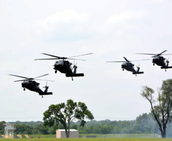 Helicopters fly over the Air Assault School on Fort Campbell as part of the Air Assault Demonstration during Week of the Eagles on May 21, 2022. (Lee Erwin)