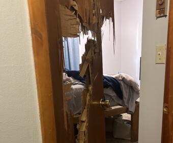 A bedroom door after the 13-year-old son of Annastacia Rodriguez broke through it with a frying pan during a fit of rage in her home. (Contributed)