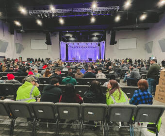 Volunteers gather at Mosaic Church to lend a helping hand in post-tornado cleanup efforts on December 14, 2023. (Wesley Irvin)
