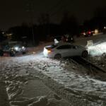 Several members of the Clarksville Jeep Crew help recover a car that slid off the road near Trenton Road around midnight on Monday, Jan. 15, 2024. (Crystal Liberatore, contributed)