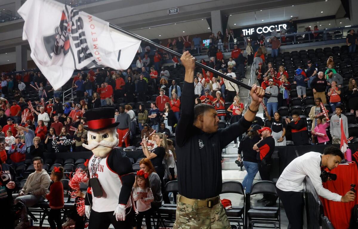 Coach Corey Gipson celebrates after Austin Peay State University basketball beat North Alabama.