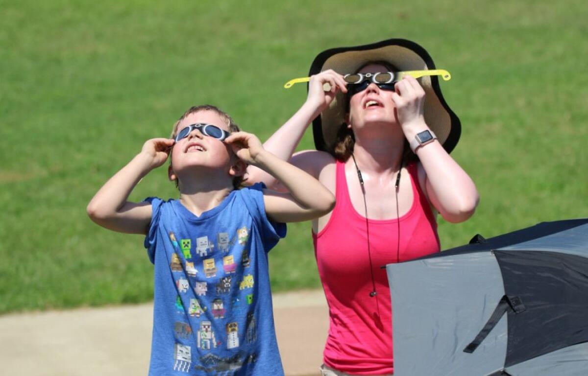 Families enjoy the solar eclipse in August 2017 at Liberty Park.