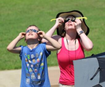 Families enjoy the solar eclipse in August 2017 at Liberty Park.