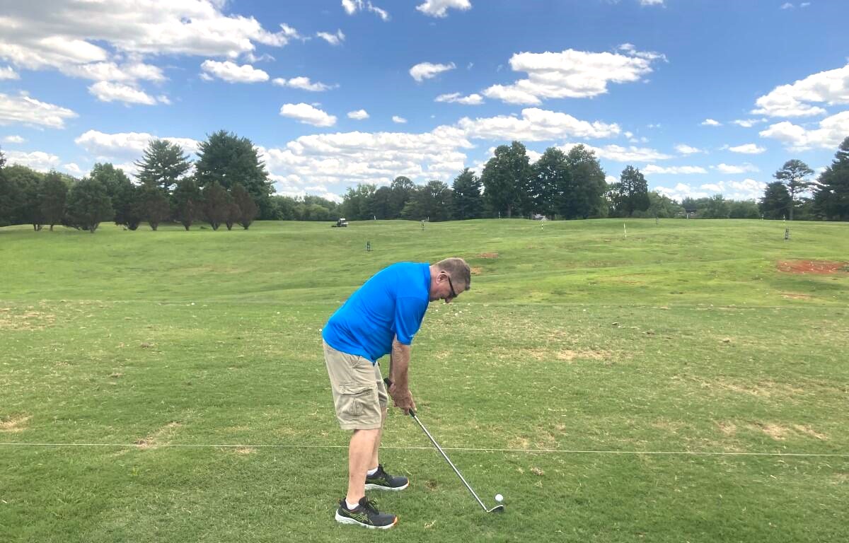 Golfer practicing on the driving range at Mason Rudolph Golf Course. (Christian Brown)