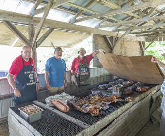 The men of the Civitan Club of Clarksville cooking some amazing food at the Annual Lone Oak Picnic. July 27, 2024. (Jeff Danault)