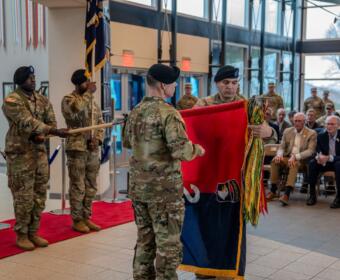 Col. Duke Reim and Command Sgt. Maj. Angelo Fazio, the command team for 2nd Mobile Brigade Combat Team (2MBCT), 101st Airborne Division, participate in a ceremony in preparation for rotation to the European theater, March 19, 2025, at Fort Campbell. (US Army photo)