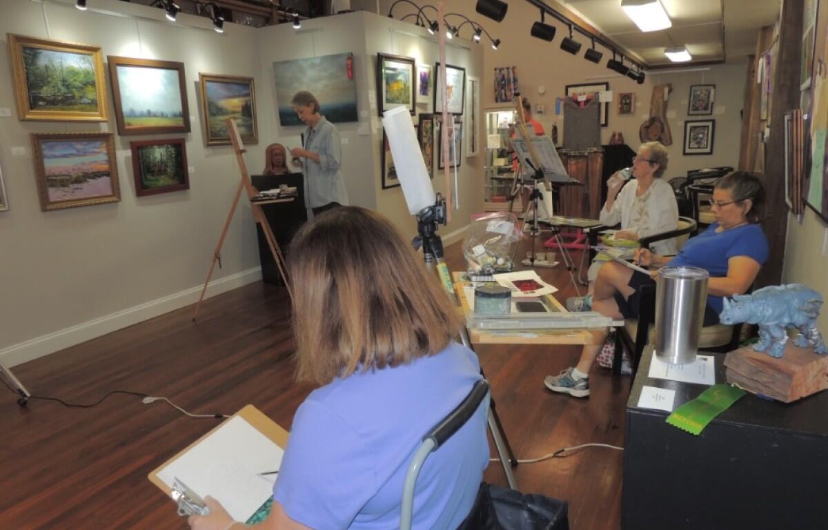 Some members of the 2 Rivers Plein Air Painters group gather at the Downtown Artists Co-Op to paint a still life. (Leah Foote, contributed)