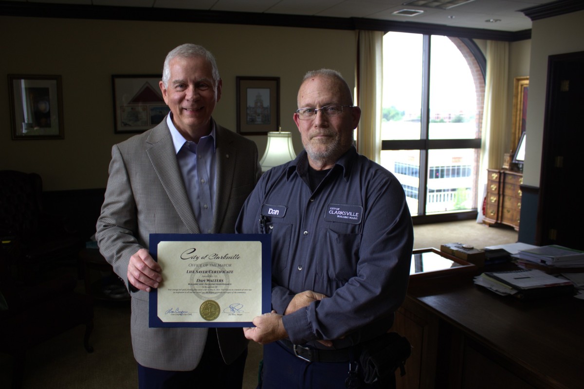City of Clarksville employee Dan Walters, right, is recognized by Mayor Joe Pitts in May 2025. (City of Clarksville, contributed)