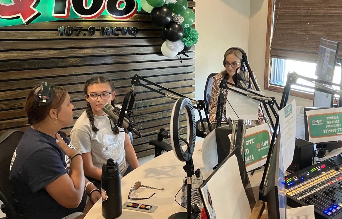 Students join Kyle King and Tiffany Hill on the air on Q108 for Q-Up the Classroom radiothon for Teachers Warehouse on July 24, 2025. (Chris Smith)