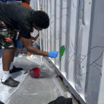 Volunteers at the Hands On and Loaves and Fishes Mural Painting on July 24