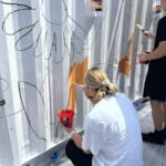 Volunteers at the Hands On and Loaves and Fishes Mural Painting on July 24