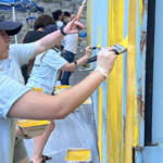 Volunteers at the Hands On and Loaves and Fishes Mural Painting on July 24