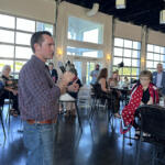 Matt Van Epps speaking at the Red River Republican Women wine tasting on July 25.
