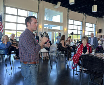 Matt Van Epps speaking at the Red River Republican Women wine tasting on July 25.