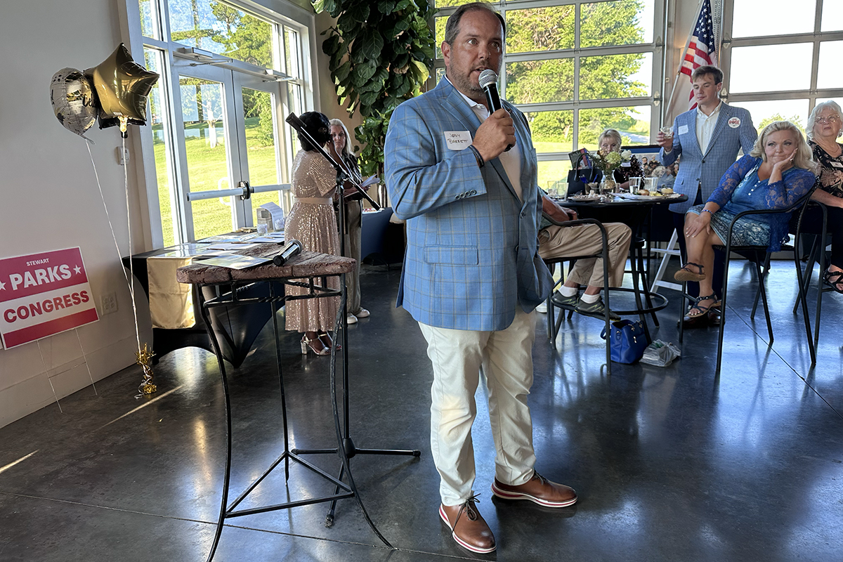 Jody Barrett speaking at the Red River Republican Women wine tasting on July 25.