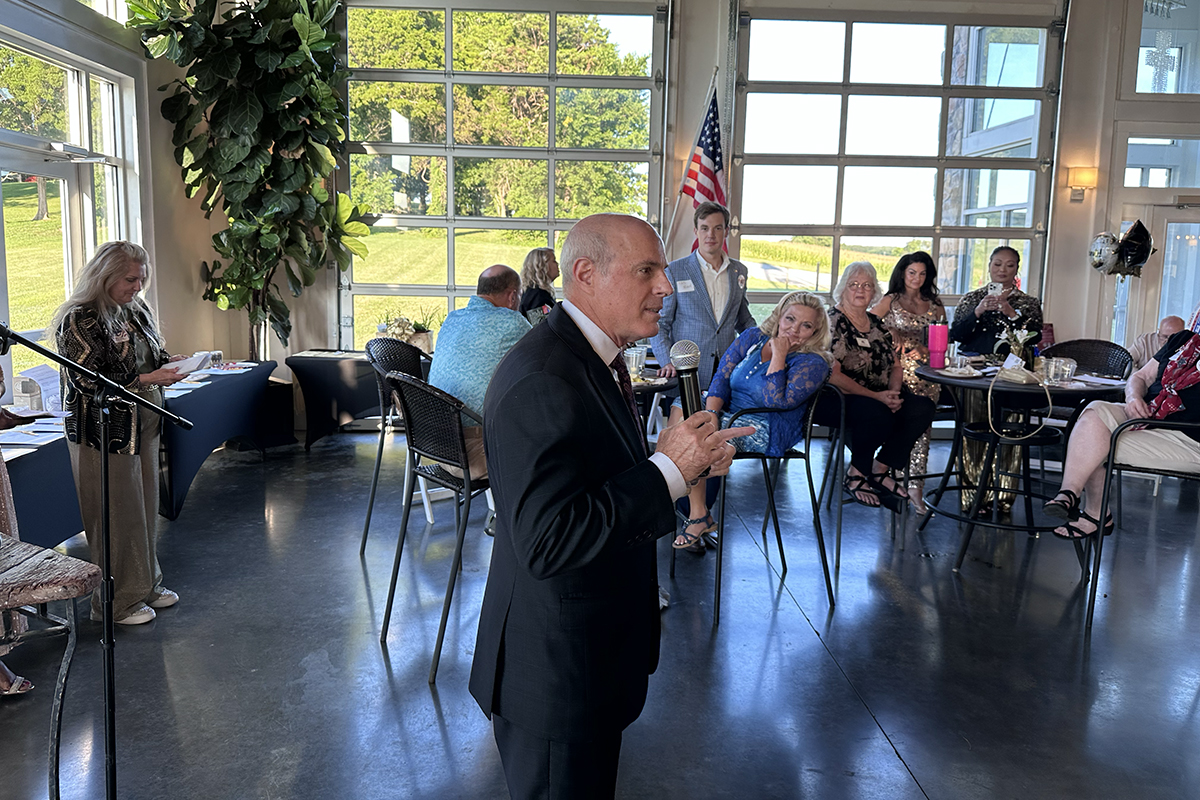 Gino Bulso speaking at the Red River Republican Women wine tasting on July 25.