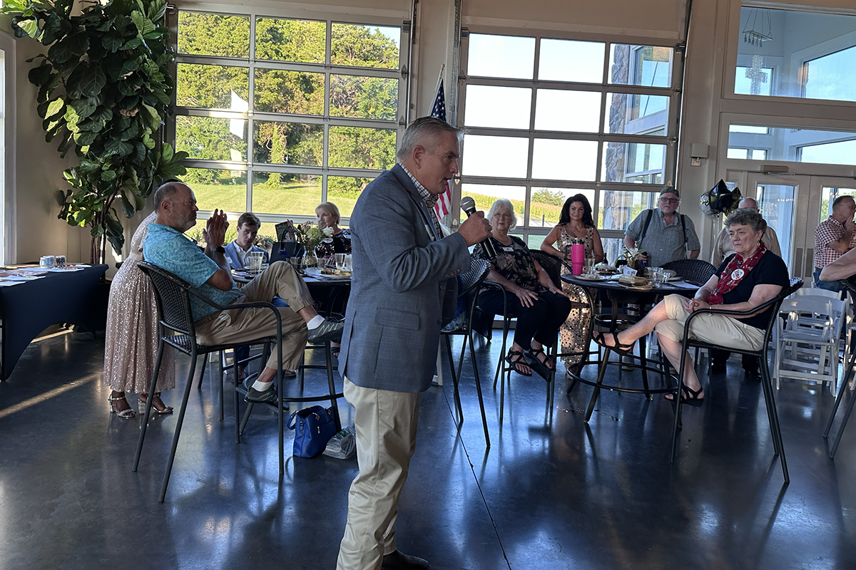 John Wilt speaking at the Red River Republican Women wine tasting on July 25.