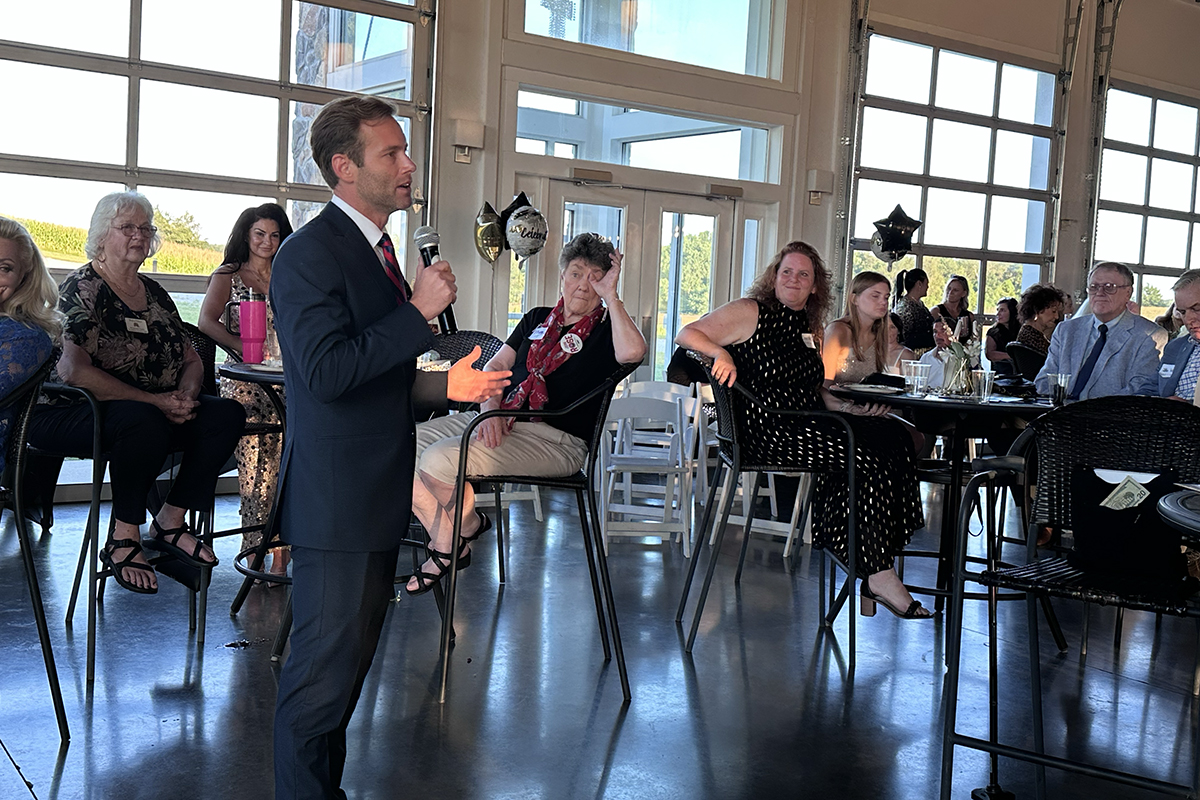 Tres Wittum speaking at the Red River Republican Women wine tasting on July 25.