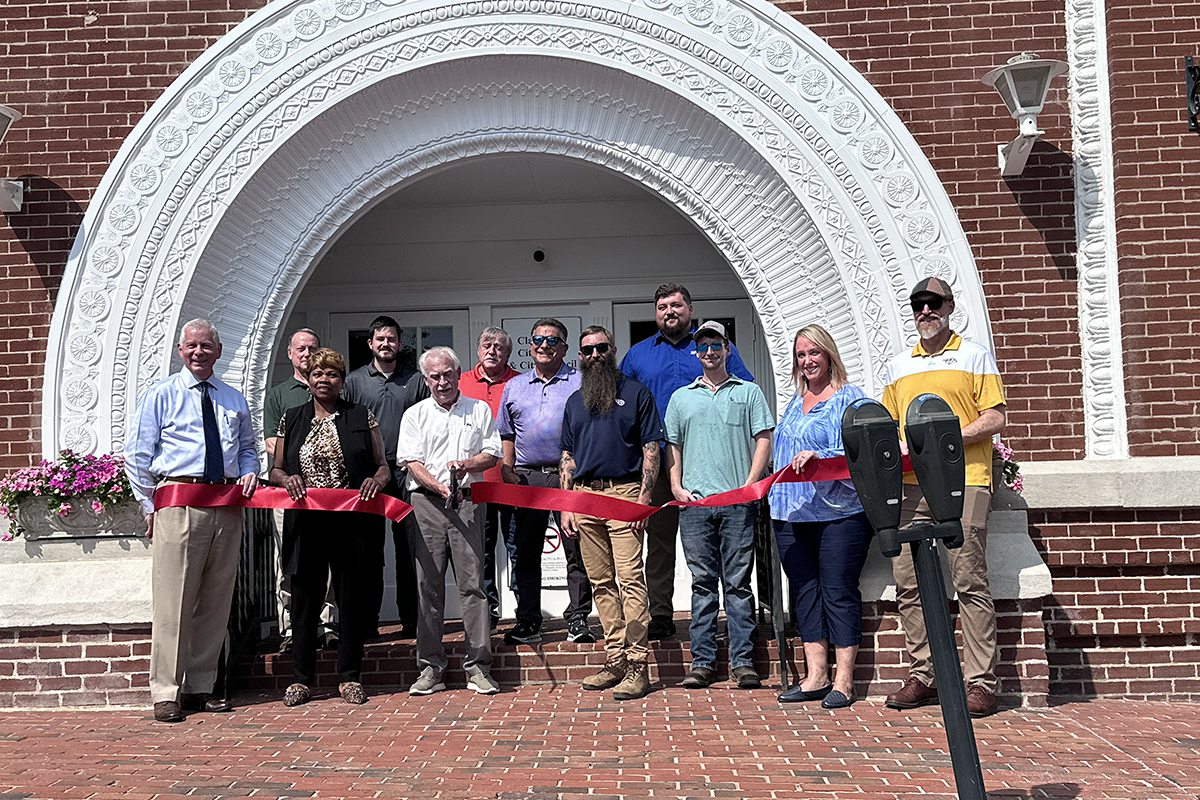 Ribbon cutting revealing the restored Public Square arch on July 31.