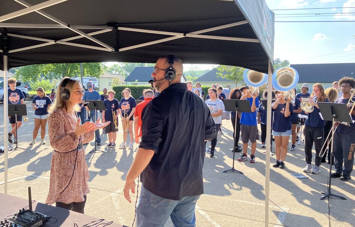 Kyle King and Tiffany Hill on the air with the Kirkwood High School Marching Band for Q-Up the Classroom radiothon for Teachers Warehouse at 5 Star Media Group on July 24, 2025. (Chris Smith)