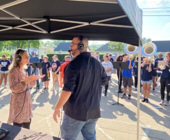 Kyle King and Tiffany Hill on the air with the Kirkwood High School Marching Band for Q-Up the Classroom radiothon for Teachers Warehouse at 5 Star Media Group on July 24, 2025. (Chris Smith)