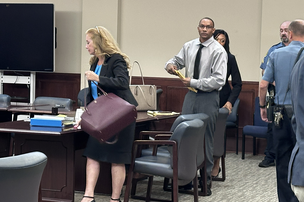 Timothy Lebrone Williams (right) and Stephanie Ritchie Mize, Williams' defense attorney, packing up to leave after another mistrial was declared on August 4.