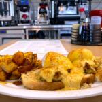 Coastal Crab Cake Benny on the menu of Eggs Up Grill at 970 Tiny Town Road Suite A-B in Clarksville. Sept. 19, 2025. (Christian Brown)