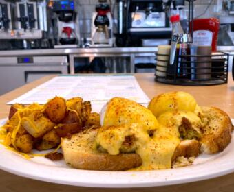 Coastal Crab Cake Benny on the menu of Eggs Up Grill at 970 Tiny Town Road Suite A-B in Clarksville. Sept. 19, 2025. (Christian Brown)
