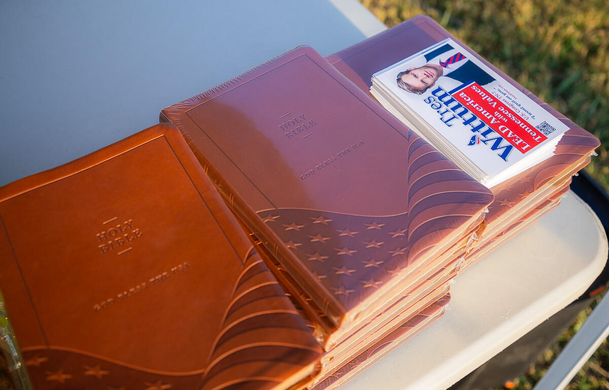 Copies of the “God Bless the USA Bible," that were handed out during the "Friday Night Lights for Faith" outside Montgomery Central High School on September 12, 2025. (Wesley Irvin)