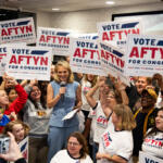 Aftyn Behn and her supporters celebrate her win as the Democratic primary winner in the special election for Congress District 7 during Behn's watch party at the Gray Fox Bar & Lounge, Oct. 7, 2025. (Jordan Renfro)