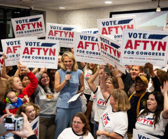 Aftyn Behn and her supporters celebrate her win as the Democratic primary winner in the special election for Congress District 7 during Behn's watch party at the Gray Fox Bar & Lounge, Oct. 7, 2025. (Jordan Renfro)