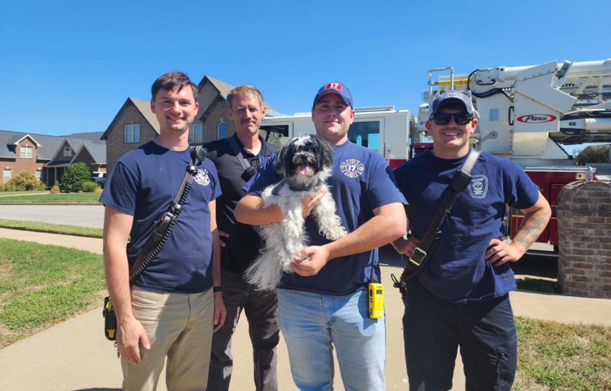 Montgomery County Fire Service members, from the left, Don Kroll, John Witherspoon, Wesley O'Brien and Nicholas Whitley, with Petey on Sept. 28, 2025. (Joy Martin, contributed)
