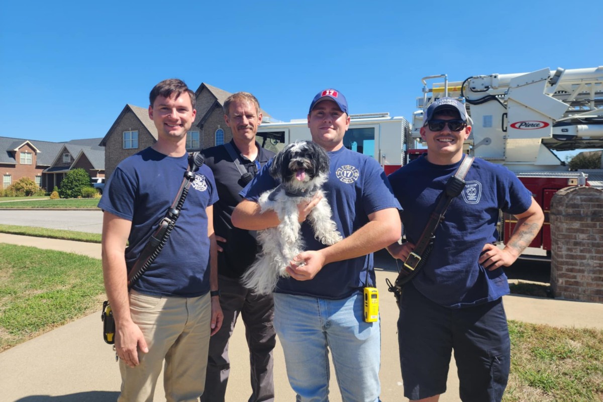 Montgomery County Fire Service members, from the left, Don Kroll, John Witherspoon, Wesley O'Brien and Nicholas Whitley, with Petey on Sept. 28, 2025. (Joy Martin, contributed)